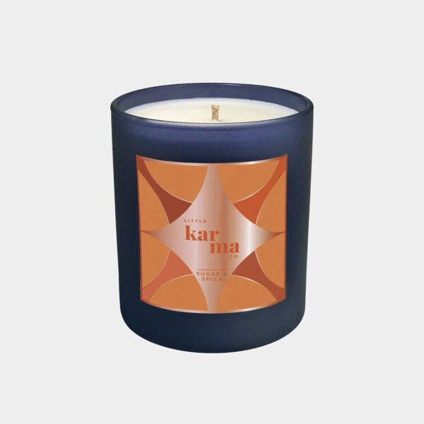 Sugar & Spice spiced chai latte refillable Christmas candle in a navy glass finished with a luxurious rose gold foil label