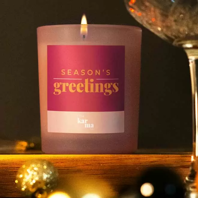 Refillable Season's Greetings scented candle in pink