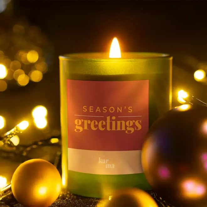 Refillable Season's Greetings scented candle in green
