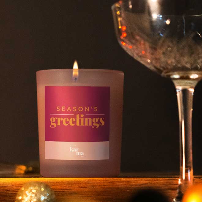 Refillable Season's Greetings scented candle in pink