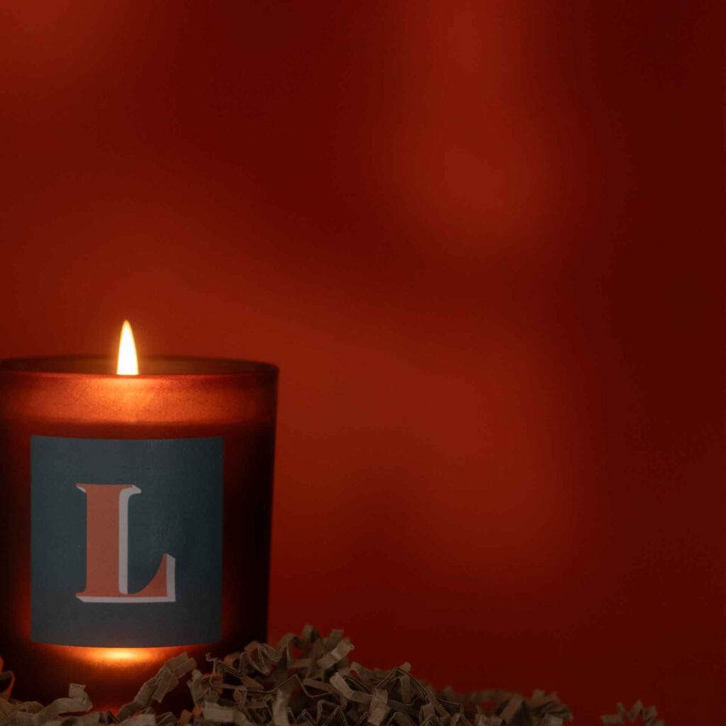 initial L candle lit