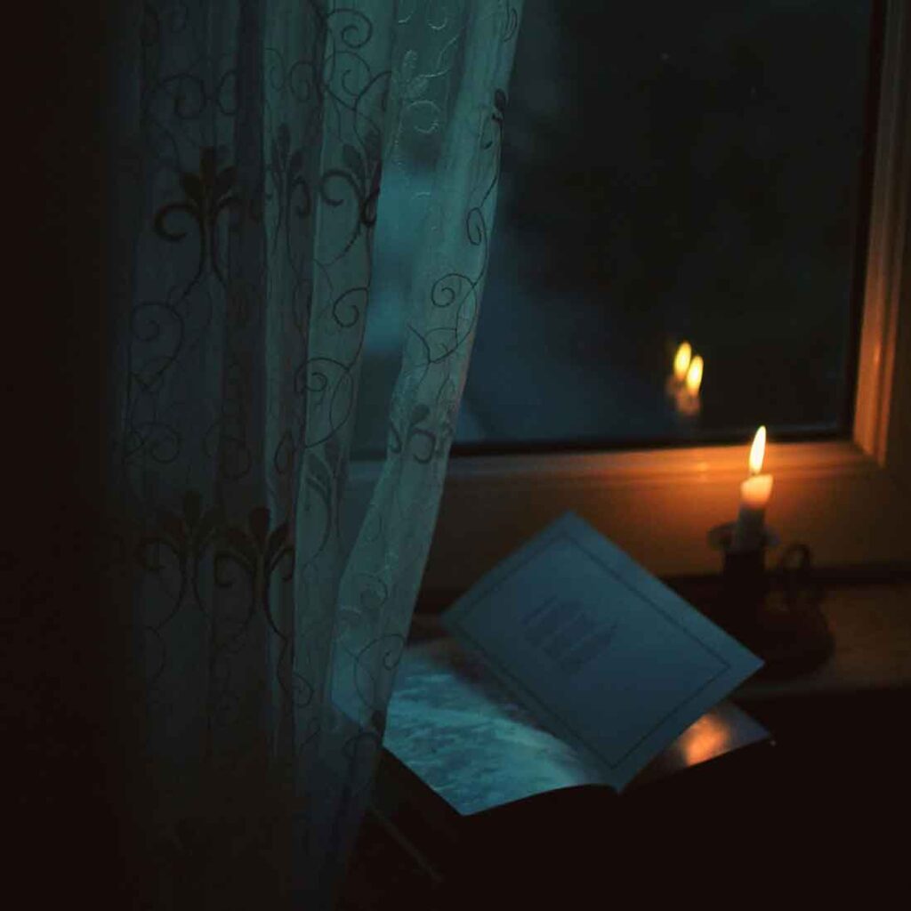 reading candlelight cosy night